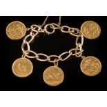 A curb-link bracelet with five various attached sovereigns: and attached safety chain,