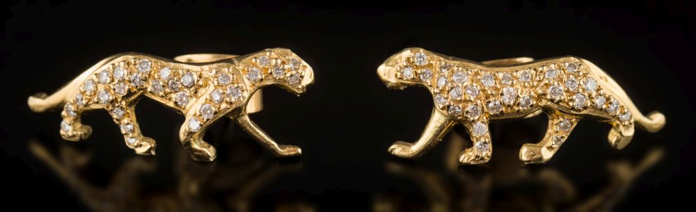 A pair of diamond mounted feline ear studs: set with circular, brilliant-cut diamonds,