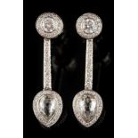 A pair of 18ct white gold and diamond pendant earrings: each with a pear-shaped briolette-cut