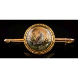 A late 19th century reverse painted crystal intaglio bar brooch: the circular crystal 19mm diameter