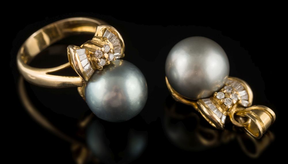 A stained cultured pearl and diamond ring: the stained cultured pearl approximately 12mm diameter