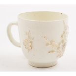 A Bow porcelain cup: the exterior sprigged with prunus branches, in the white,