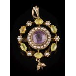 An early 20th century gold, amethyst, peridot and seed pearl circular pendant brooch: ,
