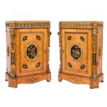 A pair of mid 19th Century kingwood, crossbanded and gilt metal mounted pier cabinets:,