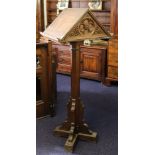 A late Victorian oak double sided lectern:, each with a ledge,