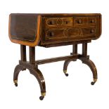 An early 19th Century rosewood and inlaid sofa table:, bordered with sycamore,