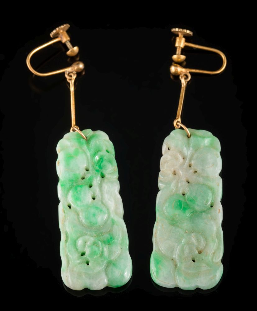 A pair of carved and pierced green jade panel pendant earrings: each jade panel 40mm long x 17mm