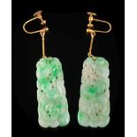 A pair of carved and pierced green jade panel pendant earrings: each jade panel 40mm long x 17mm