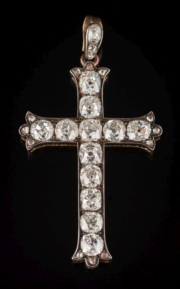 A 19th century diamond mounted twelve-stone 'cross' pendant: set with cushion shaped,