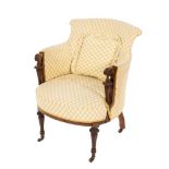 An Edwardian mahogany and inlaid tub-shaped armchair:,