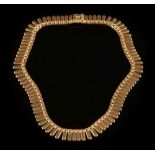 An 18ct gold fringe necklace:, 43gms gross weight.