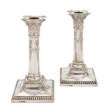 A pair of George V silver Corinthian column candlesticks, maker Lee & Wigfull, Sheffield,