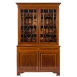 An Edwardian mahogany, satinwood crossbanded and inlaid bookcase:,