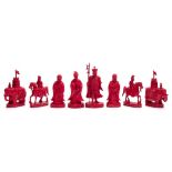 A 19th century Chinese Export carved and stained ivory export chess set: one side stained red with