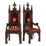 A pair of Victorian Gothic carved oak Armchairs in the manner of Pugin:,