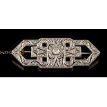 An Art Deco 18ct white gold and diamond mounted rectangular brooch: of openwork design with
