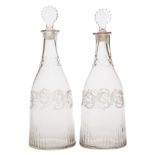 A pair of Irish mould blown decanters: each of mallet shaped form with a fret cut lozenge shaped