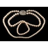 A graduated cultured pearl two-string necklace: with cultured pearls graduated from 4.5mm to 6.