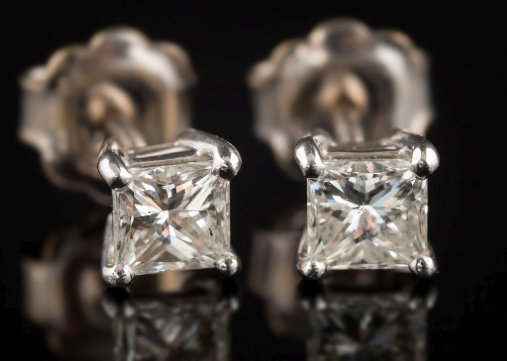 A pair of 18ct white gold and princess-cut diamond single-stone ear studs: each approximately 0.