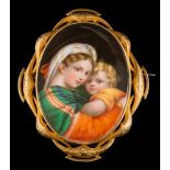 A Meissen porcelain oval portrait brooch depicting the 'Madonna and Child': the oval porcelain