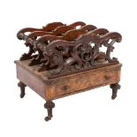 A Victorian burr walnut, boxwood inlaid and carved three division canterbury:,