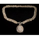 A late 19th century silver necklace: of foliate engraved shield-shaped links,