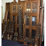 The Late Victorian carved oak and glazed entrance porch:, with octagonal panelled canopy,