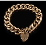 A 9ct gold curb-link bracelet: with 9ct gold padlock clasp and attached safety chain,