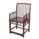 A Chinese hardwood armchair:, the back with shaped and stepped top rail and curved spindle uprights,