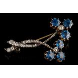 A late Victorian sapphire and diamond floral spray brooch: with two flower heads,
