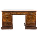 An Edwardian rosewood and marquetry kneehole desk:, the rectangular top with a moulded edge,