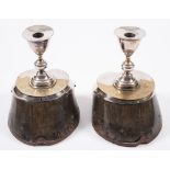 A pair of silver plate mounted hoof candlesticks inscribed 'Solomon':, 19cm high.