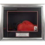 An Everlast boxing glove signed by nine World Heavyweight Champions:, Muhammad Ali, George Foreman,