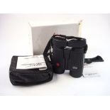 A pair of Leica 10 x 42 BA binoculars:, black reinforced casing in a soft leather case,