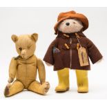 A Chad Valley Paddington Bear:, in brown felt hat and duffel coat and yellow Wellington boots,