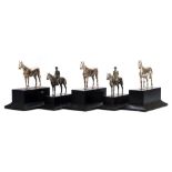 A collection of five silver plated equestrian trophies:, three in the form of a horse ,