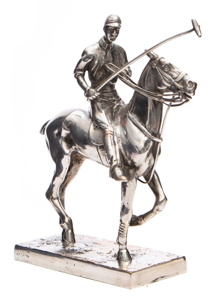 An Elkington & Co silver plated figure of a Polo player on horseback:,