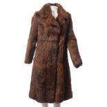 A three quarter length fur coat together with three fur jackets,