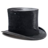 A black silk top hat in a box by Herbert Johnson, London:, size 7 1/2.