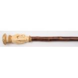 A 19th century carved ivory and blackthorn walking cane:,