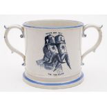 A pottery commemorative loving cup: printed in dark blue with a pair of mustachioed soldiers above