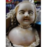 A Victorian poured wax shouldered head doll:, with applied blonde wig,