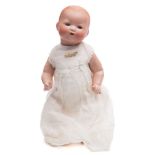 An Armand Marseille bisque head baby doll:, numbered 351/3K with moulded hair, blue glass eyes,