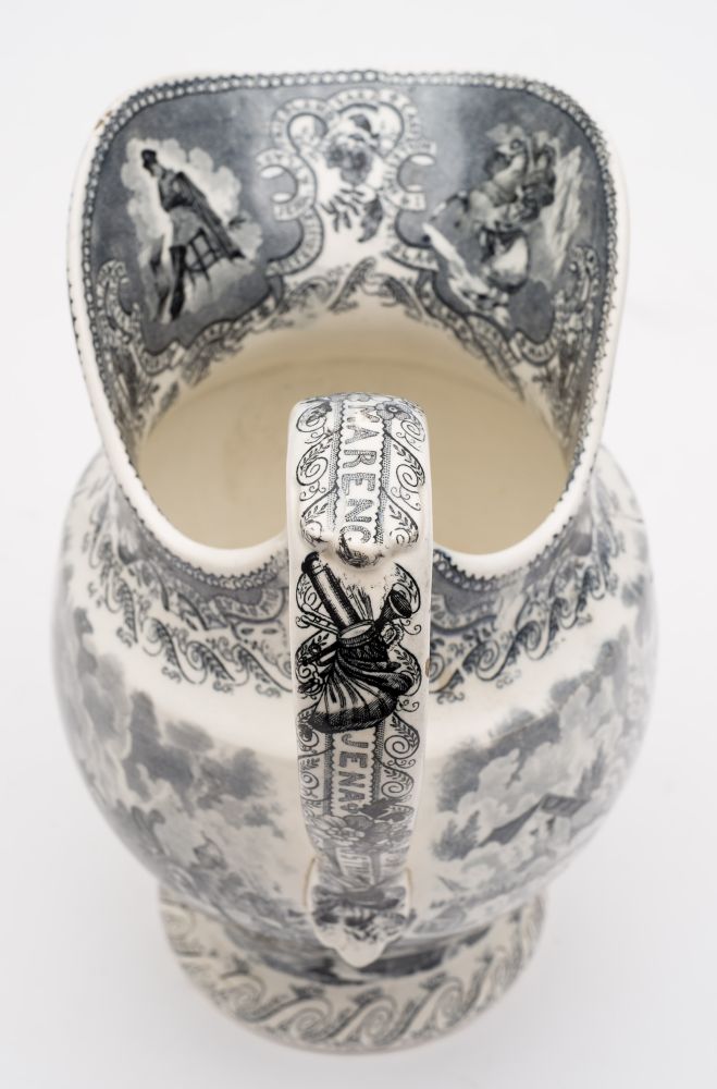 A Boch Freres Napoleonic campaigns jug: of helmet shaped form printed in black with battle scenes, - Image 2 of 3