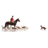 A Beswick hunting group comprising a huntsman, fox and nine hounds:.