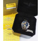 7.5.) Uhren Breitling - Chronomat Automatic.Stahl und Gold, marineblaues Zifferblatt mit goldenen