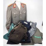 4.1.) Uniformen / Kopfbedeckungen DDR / BRD: 7 Uniformen - u.a. General der Landstreitkräfte.Diverse