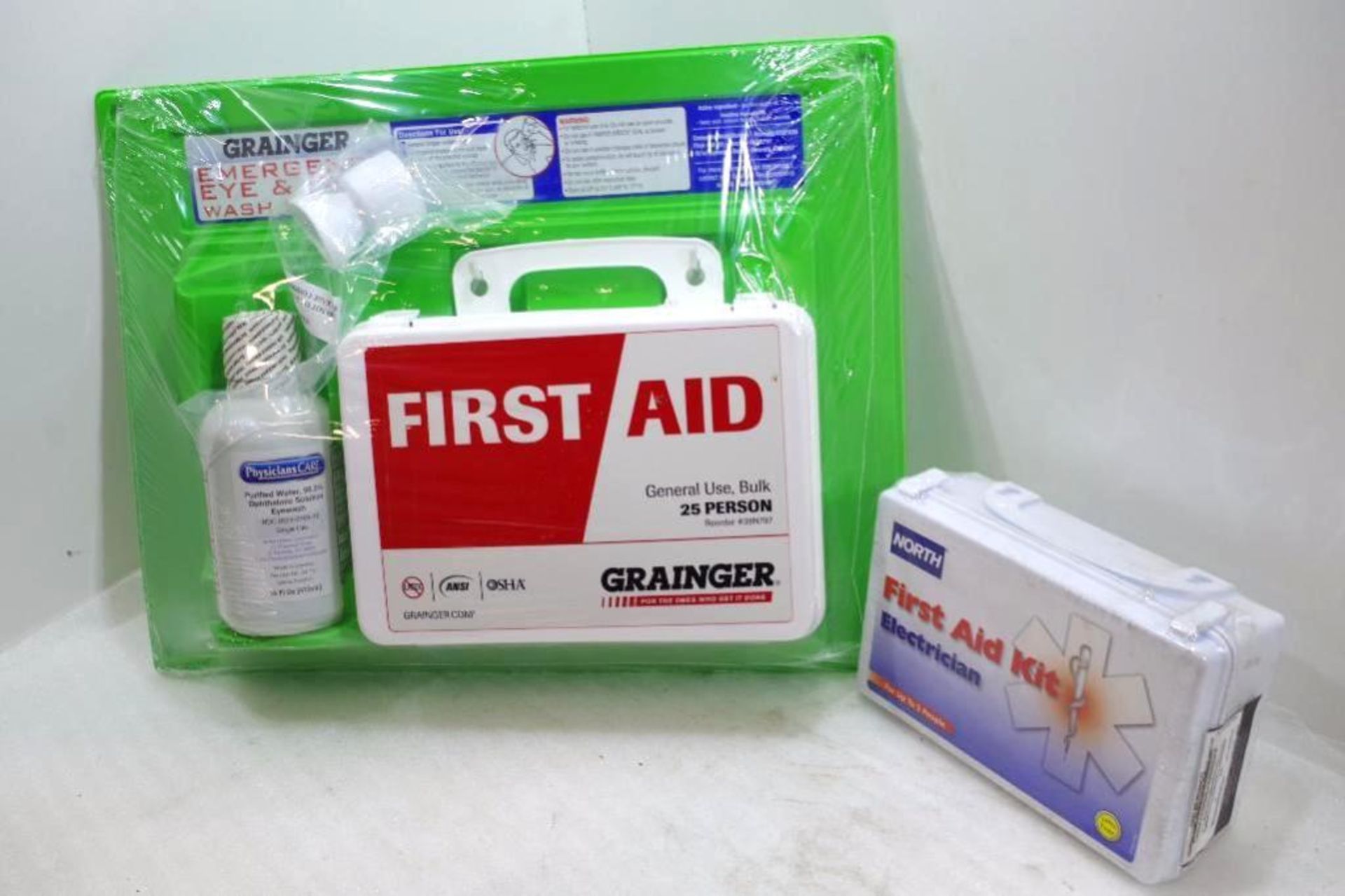 GRAINGER Eye Wash Station w/General Purpose First Aid Kit & NORTH Electrician First Aid Kit