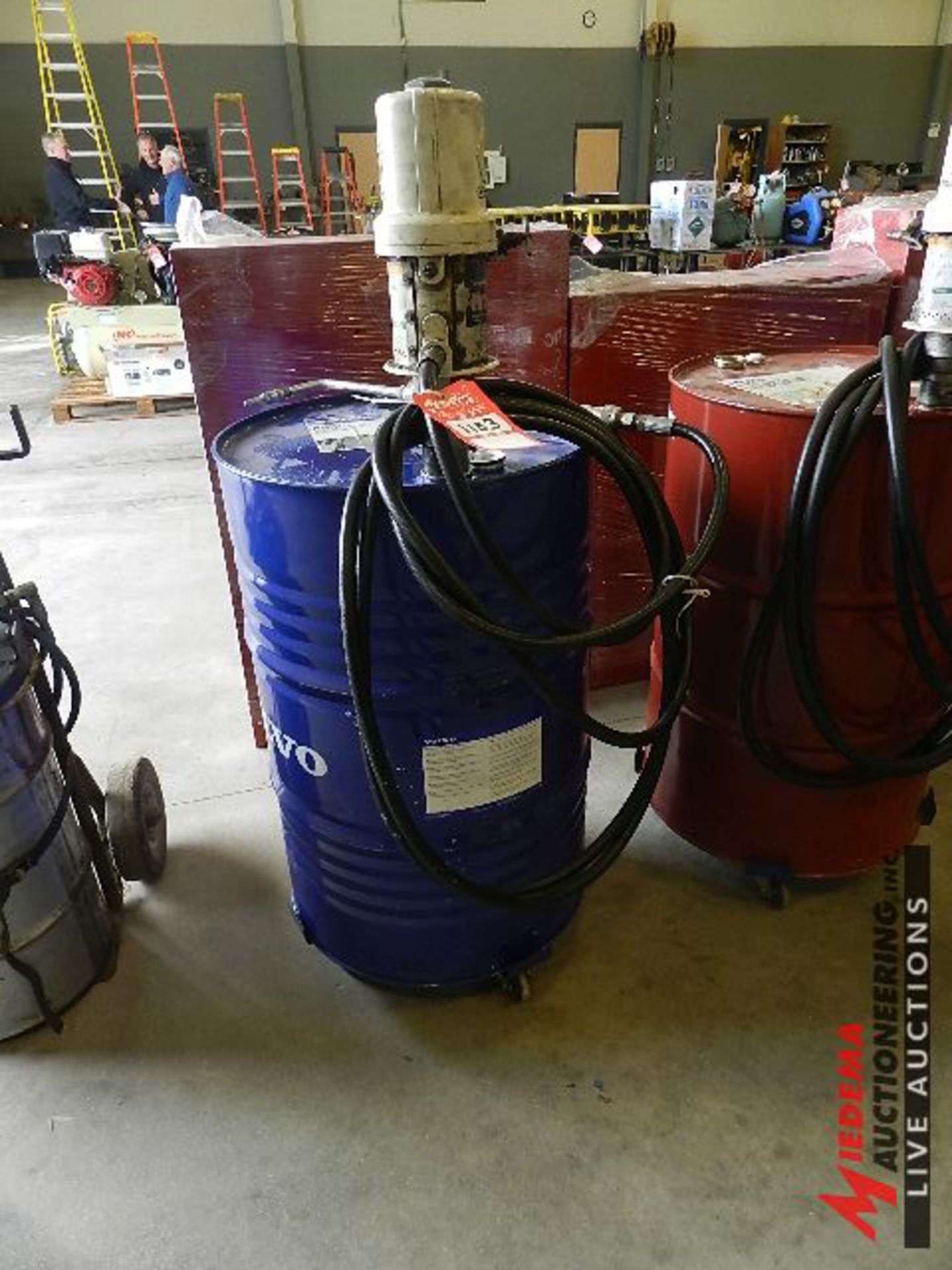 GRACO FIRE-BALL 300 PNEUMATIC PUMP WITH HOSE AND GUN WITH PARTIAL BARREL OF WET BRAKE OIL