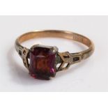 9 carat gold ring, set with a purple paste stone